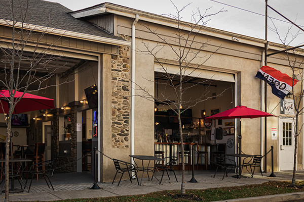 Jive Bar with open doors and red umbrellas