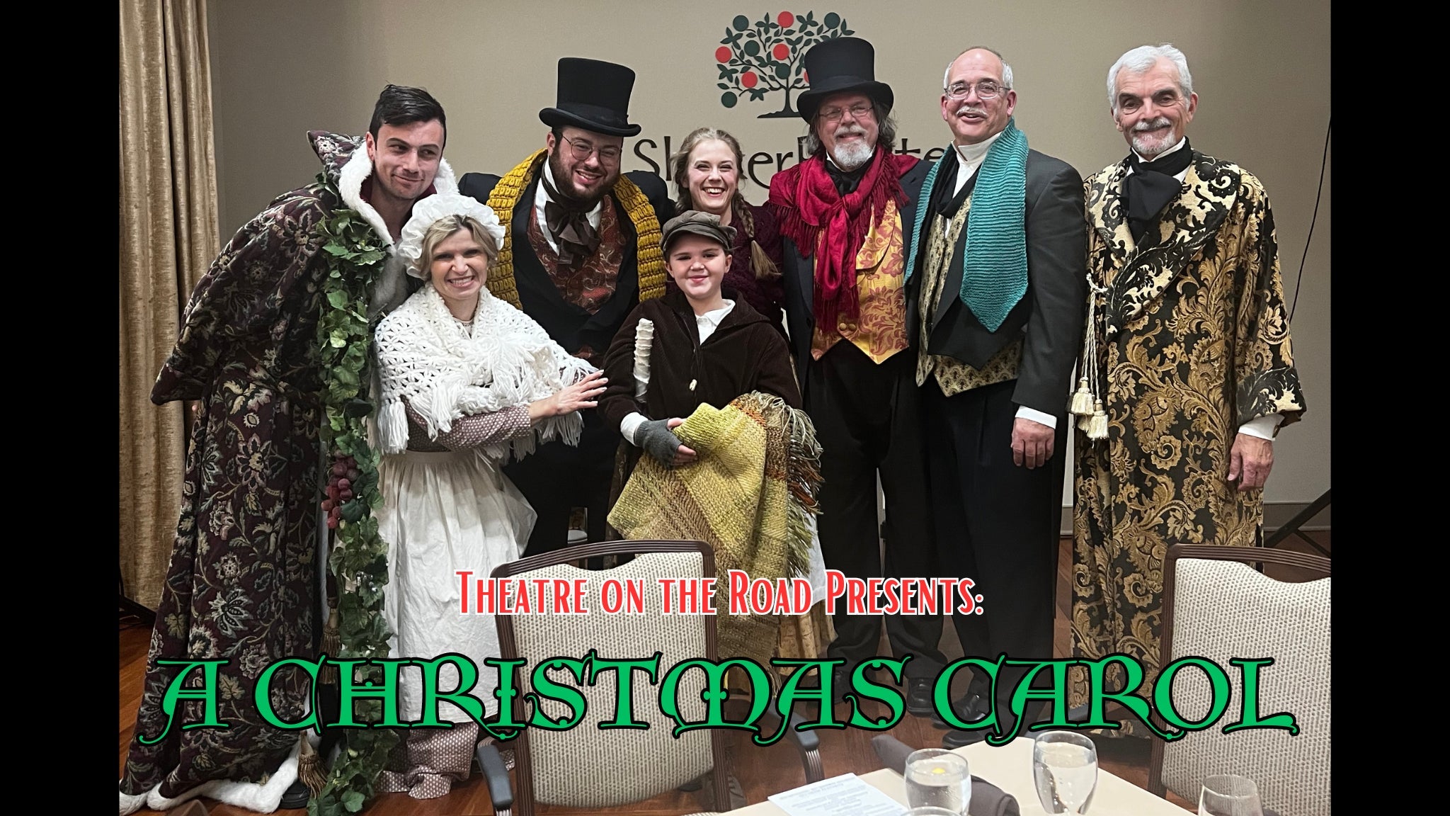 a group of people dressed in costumes posing for a picture